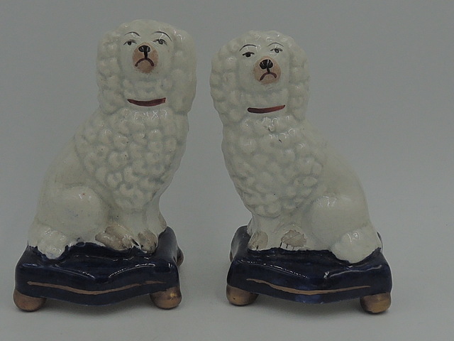 Antique Staffordshire Pair of Seated Poodles on Platform Cobalt Blue Cushions